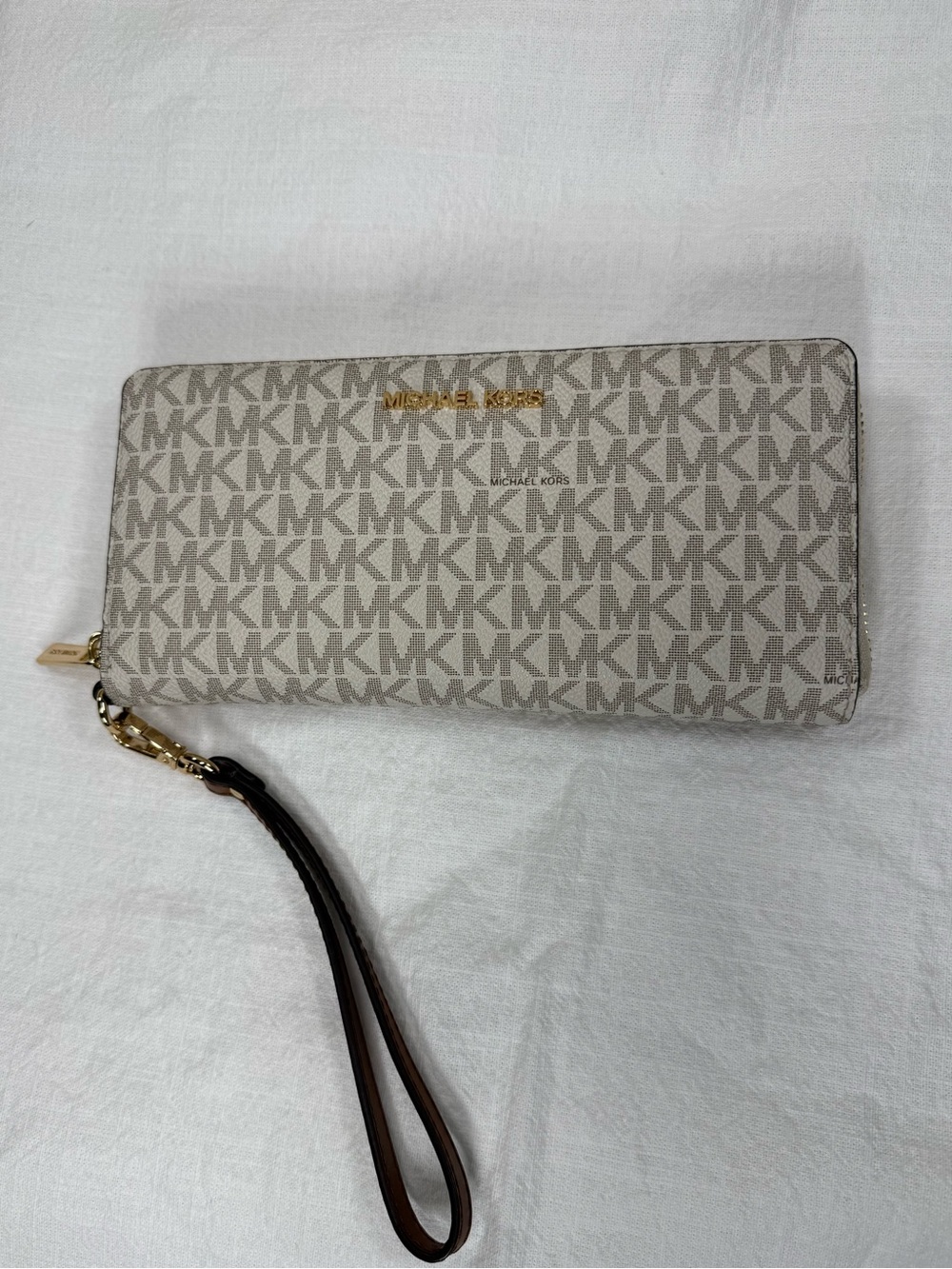 Michael Kors Cream Signature Zip-Around Wristlet with Brown Strap